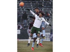 Colorado Rapids forward Diego Rubio (7) challenges Portland Timbers defender Zarek Valentin (16) for the ball in the first half of an MLS soccer game Saturday, March. 2, 2019 in Commerce City, Colo.