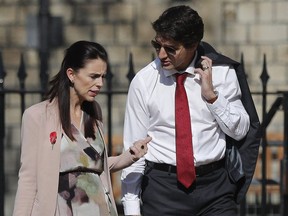 The Prime Minister of New Zealand Jacinda Ardern, left, talks to the Canadian Prime Minister Justin Trudeau as they arrive for the the second day of the Commonwealth Heads of Government 2018 for a behind closed doors meeting in Windsor, England, Friday, April 20, 2018. Trudeau spoke with his counterpart in New Zealand on Saturday, offering his condolences for the 50 people killed and dozens injured following Friday's shootings at two mosques in Christchurch.