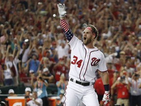 Washington Nationals Bryce Harper (34) reacts to his winning hit during the Major League Baseball Home Run Derby, in Washington on July 16, 2018. The Philadelphia Phillies have announced Bryce Harper's 13-year contract, the largest deal in baseball history at $330 million.