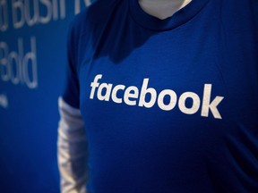 Guest are welcomed by people in Facebook shirts as they arrive at the Facebook Canadian Summit in Toronto on March 28, 2018.