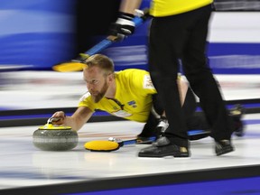 Sweden skip Niklas Edin delivers a stone against Canada during a gold medal game at the World Men's Curling Championship in Las Vegas on April 8, 2018.