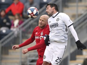 Toronto FC midfielder Michael Bradley (4) battles Philadelphia Union midfielder midfielder Ilsinho (25) for a header in the first half of an MLS soccer match in Chester, Pa., on March 2, 2019. After a bye week, Toronto FC looks to build on its season-opening win in Philadelphia when it hosts the New England Revolution on Sunday in its home opener at BMO Field.