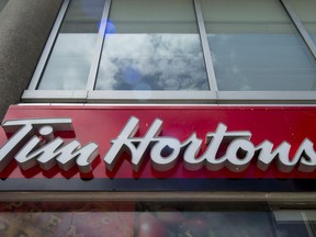A Tim Hortons coffee shop in downtown Toronto, on Wednesday, June 29, 2016. Some 1,500 Tim Hortons franchisees will receive a copy of a proposed settlement in two class-action lawsuits against their parent company today.