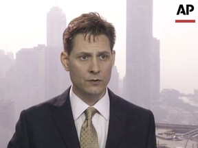 In this image made from a video taken on March 28, 2018, North East Asia senior adviser Michael Kovrig speaks during an interview in Hong Kong. Global Affairs Canada says its consular officials in China were allowed a visit with detained former diplomat Michael Kovrig today. It is the fifth time Kovrig is receiving a consular visit since he was detained by Chinese authorities in early December but the first since he and fellow detainee Michael Spavor were charged with stealing state secrets two weeks ago. THE CANADIAN PRESS/AP Photo