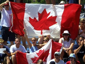 Fans cheer on Canadian volleyball players during the Francophonie Games in Ottawa, Thursday, July 19, 2001. The International Organization of La Francophonie is relaunching it's call for bids for the 2021 Francophonie Games, a month after New Brunswick pulled the plug on hosting the sports and arts event.