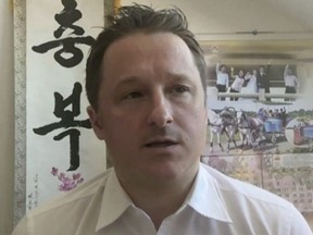 In this image made from video taken on March 2, 2017, Michael Spavor, director of Paektu Cultural Exchange, talks during a Skype interview in Yangi, China. Global Affairs Canada says detained Canadian businessman Michael Spavor received a visit from consular officials in China today. The visit comes a day after former diplomat Michael Kovrig was also paid a visit by Canadian officials. THE CANADIAN PRESS/AP Photo