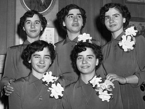 The Dionne Quintuplets are shown in this 1952 photo. Front left to right. Cecile and Yvonne, and back Marie, Emilie and Annette. Despite the incalculable ink that's been spilled over the Dionne quintuplets, author Shelley Wood says the full truth may never be known about the girls' cloistered childhood inside Quintland, the compound near North Bay, Ont., where the girls were raised on public display. THE CANADIAN PRESS/AP