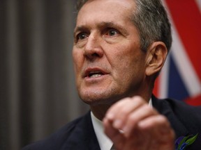 Manitoba Premier Brian Pallister speaks to media after the reading of the throne speech at the Manitoba Legislature in Winnipeg, Tuesday, Nov. 20, 2018. The province is taking action to shield Manitobans from an increase in the cost to their home-heating bills. It will not apply the provincial sales tax (PST) to the federal government's carbon tax, Premier Brian Pallister announced today.