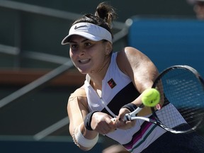 Bianca Andreescu, of Canada, returns a shot to Angelique Kerber, of Germany, during the women's final at the BNP Paribas Open tennis tournament Sunday, March 17, 2019, in Indian Wells, Calif. Bianca Andreescu is ready for a break after her breakout start to the season. The Canadian teenager started the year at No. 152 in the world rankings but has jumped all the way up to No. 24 after winning the Indian Wells title last weekend.