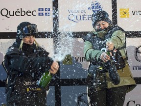 Julia Marino, right, of the USA, celebrates her victory with second place Laurie Blouin, left, of Stoneham, Que. at the big air snowboard world cup finale, on March 24, 2018 in Quebec City. Canada's Laurie Blouin will feel right at home as the World Cup snowboarding circuit makes a stop in Quebec City this weekend. Blouin, from Stoneham, Que., lives a short drive away from the 2019 Jamboree festival venue, which will host FIS snowboard and freestyle ski big air finals on Saturday. Blouin is an event headliner after winning Olympic silver last year and taking big air gold at the X Games in late January.