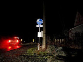 A truck drives by an evacuation route sign in Jordan River, B.C., on Tuesday, January 23, 2018. A researcher says people living in more than 90 per cent of households in Port Alberni, B.C., left for higher ground in the dead of night during a tsunami warning on Jan. 23, 2018. And although there was no tsunami, lessons can still be learned from the response.