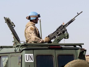 A Canadian Armed Forces soldier provides security as Canadian Prime Minister Justin Trudeau arrives on the United Nations in Gao, Mali, Saturday December 22, 2018. The United Nations is formally asking Canada to extend its mission in Mali in what appears to be a last-ditch effort to prevent a gap in the provision of life-saving medical evacuations for wounded peacekeepers.THE CANADIAN PRESS/Adrian Wyld