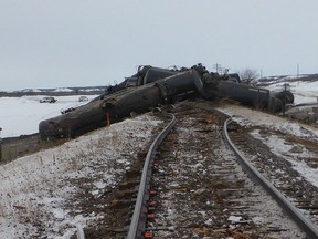 Derailed rail cars near St-Lazare, Man. are shown in a handout photo from the Transportation Safety Board. Investigators say at least one million litres of crude oil was released when a train derailed last month on a ranch in western Manitoba.THE CANADIAN PRESS/HO-Transportation Safety Board MANDATORY CREDIT