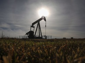 British Columbia's auditor general says there are almost 7,500 inactive oil and gas wells in the province that have not been properly decommissioned. A pumpjack works at a well head on an oil and gas installation near Cremona, Alta., Saturday, Oct. 29, 2016.