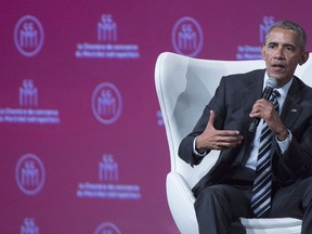 Former U.S. President Barack Obama listens to a question from moderator Sophie Brochu following a speech before the Montreal Board of Trade Tuesday, June 6, 2017 in Montreal. Obama has told a crowd in the heart of Canada's oilpatch that there needs to be a switch to cleaner energy sources.
