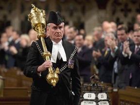 The Sergeant-at-Arms Kevin Vickers receives a standing ovation as he enters the House of Commons Thursday October 23, 2014 in Ottawa. Former House of Commons sergeant-at-arms Kevin Vickers is expected to announce today if he intends to seek the Liberal leadership in New Brunswick.