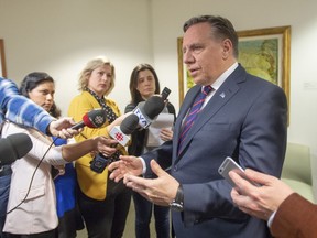 Quebec Premier Francois Legault speaks to the media on Friday, February 15, 2019 in Montreal. The Coalition Avenir Quebec government is expected to table its secularism bill today, fulfilling an election promise to ban many public sector employees from wearing religious symbols at work.
