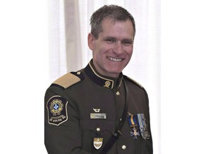 The past two years have not been easy for Quebec's three major police forces, whose officers have been working in a climate of suspicion, scandal and now an allegation of criminal wrongdoing at the highest level. Martin Prud'homme, newly-appointed interim chief of police in Montreal smiles after he was decorated Officer of the Order of Merit of the Police Forces at the Citadelle in Quebec City on Thursday, Dec. 7, 2017.