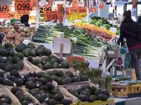 Various vegetables are on display for sale at the Jean Talon Market in Montreal on January 11, 2016. The fruit-and-vegetable-heavy fare touted in the new federal food guide may be too expensive -- or perhaps just not enticing enough -- to easily form the basis of most Canadians' diets, a new report suggests. Researchers at Dalhousie University and the University of Guelph found over 52 per cent of consumers surveyed said they face barriers in adopting the guide's recommendations.