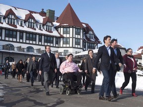 The last year has seen a number of wins when it comes to actions to improve outcomes for women and girls in Canada, but the if the Trudeau government wants to firmly advance women's rights and gender equality, bigger investments are needed. Prime Minister Justin Trudeau leads his cabinet as they stroll to a media availability during a cabinet retreat at the Algonquin Resort in St. Andrews, N.B. on Monday, Jan. 18, 2016.