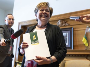 Finance Minister Donna Harpauer speaks to media at the reveal of her budget shoes at the Legislative Building in Regina on Monday, March 18, 2019. For the first time in years, the Saskatchewan Party government will present a budget that the minister says is balanced.THE CANADIAN PRESS/Michael Bell