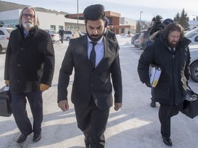 Jaskirat Singh Sidhu leaves with his lawyers Mark Brayford, right, and Glen Luther after the third day of sentencing hearings in Melfort, Sask., Wednesday, Jan. 30, 2019. A truck driver who caused the deadly Humboldt Broncos crash is to be sentenced in a Saskatchewan courtroom today.