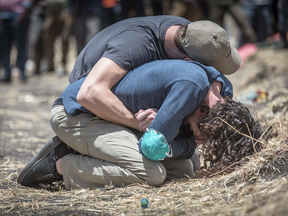 Relatives mourn at the scene where the Ethiopian Airlines Boeing 737 Max 8 crashed shortly after takeoff on Sunday killing all 157 on board, near Bishoftu, Ethiopia, March 13, 2019.