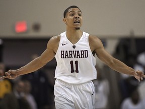 Harvard's Bryce Aiken gestures after scoring a three-point basket during the first half of an NCAA college basketball game for the Ivy League championship against Yale in New Haven, Conn., Sunday, March 17, 2019, in New Haven, Conn.