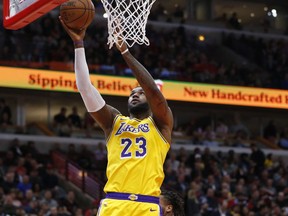 Los Angeles Lakers forward LeBron James (23) goes to the basket past Chicago Bulls guard Wayne Selden (14) during the first half of an NBA basketball game Tuesday, March 12, 2019, in Chicago.