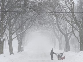A man uses a snowblower to clear snow during a snowstorm in Halifax on Monday, March 4, 2019.