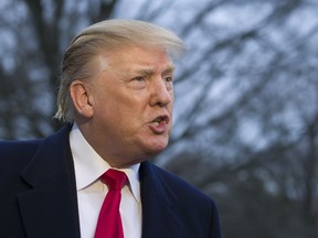 President Donald Trump speaks with the media after stepping off Marine One on the South Lawn of the White House, Sunday, March 24, 2019, in Washington. The Justice Department said Sunday that special counsel Robert Mueller's investigation did not find evidence that President Donald Trump's campaign "conspired or coordinated" with Russia to influence the 2016 presidential election.