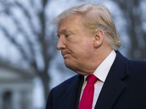 President Donald Trump departs after speaking with the media after stepping off Marine One on the South Lawn of the White House, Sunday, March 24, 2019, in Washington. The Justice Department said Sunday that special counsel Robert Mueller's investigation did not find evidence that President Donald Trump's campaign "conspired or coordinated" with Russia to influence the 2016 presidential election.