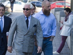 Roger Stone, an associate of President Donald Trump, arrives at the U.S. District Court, for a court status conference on his seven charges: one count of obstruction of an official proceeding, five counts of false statements, and one count of witness tampering, in Washington, Thursday, March 14, 2019. Stone has pleaded not guilty to the charges.