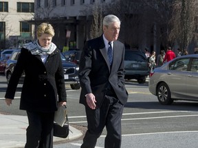 Special Counsel Robert Mueller, and his wife Ann, walk to their car after attending services at St. John's Episcopal Church, across from the White House, in Washington, Sunday, March 24, 2019. Mueller closed his long and contentious Russia investigation with no new charges, ending the probe that has cast a dark shadow over Donald Trump's presidency.