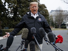 President Donald Trump talks with reporters outside the White House before traveling to Alabama to visit areas affected by the deadly tornadoes, Friday, March 8, 2019, in Washington.