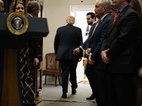 President Donald Trump departs after a signing ceremony for an executive order on a "National Roadmap to Empower Veterans and End Veteran Suicide," in the Roosevelt Room of the White House, Tuesday, March 5, 2019, in Washington.