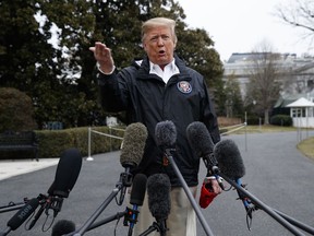 President Donald Trump talks with reporters outside the White House before traveling to Alabama to visit areas affected by the deadly tornadoes, Friday, March 8, 2019, in Washington.