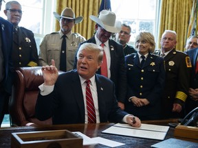 President Donald Trump speaks about border security in the Oval Office of the White House, Friday, March 15, 2019, in Washington. Trump issued the first veto of his presidency, overruling Congress to protect his emergency declaration for border wall funding.
