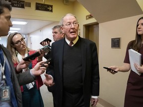 Sen. Lamar Alexander, R-Tenn., tells reporters that he will vote for a resolution to annul President Donald Trump's declaration of a national emergency at the southwest border, on Capitol Hill in Washington, Thursday, March 14, 2019.