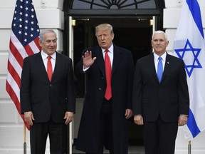 President Donald Trump and Vice President Mike Pence, greet Israeli Prime Minister Benjamin Netanyahu to the South Lawn of the White House in Washington, Monday, March 25, 2019.