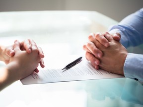 A man and woman sit across a table from each other with a document in between them. In 2015, a Chinese couple arranged  to give birth to their son in Richmond, B.C., so that he would have automatic Canadian citizenship. What they didn’t anticipate at the time was the legal and jurisdictional quagmire they would find themselves in when their relationship broke apart.