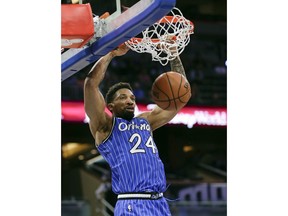 Orlando Magic's Khem Birch makes an uncontested dunk against the Cleveland Cavaliers during the first half of an NBA basketball game, Thursday, March 14, 2019, in Orlando, Fla.