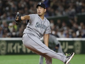 Seattle Mariners starter Yusei Kikuchi pitches against the Oakland Athletics in the first inning of Game 2 of their Major League baseball opening series at Tokyo Dome in Tokyo, Thursday, March 21, 2019.