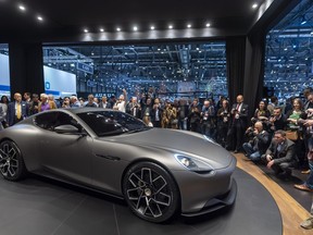 Visitors look at the 'Piech Mark Zero' electric car during the press day at the '89th Geneva International Motor Show' in Geneva, Switzerland, Tuesday, March 05, 2019. The 'Geneva International Motor Show' takes place in Switzerland from March 7 until March 17, 2019. Automakers are rolling out new electric and hybrid models at the show as they get ready to meet tougher emissions requirements in Europe - while not forgetting the profitable and popular SUVs and SUV-like crossovers.