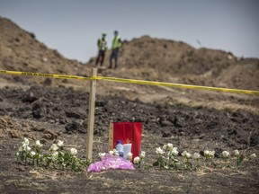 Flowers are left at the scene where the Ethiopian Airlines Boeing 737 Max 8 plane crashed shortly after takeoff on Sunday killing all 157 on board, near Bishoftu, south of Addis Ababa, in Ethiopia Wednesday, March 13.