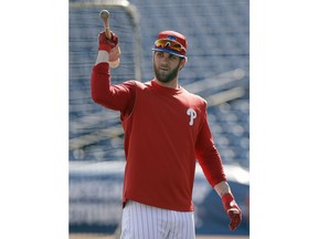 Philadelphia Phillies' Bryce Harper waits his turn in the batting cage before a spring training baseball game against the Toronto Blue Jays Saturday, March 9, 2019, in Clearwater, Fla.