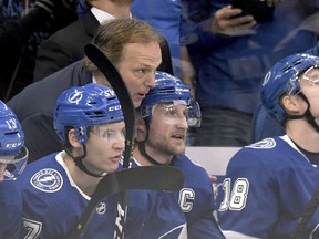 Tampa Bay Lightning head coach Jon Cooper congratulates center Steven Stamkos (91) after becoming the all-time franchise goal leader (384) with his first period goal during the first period of an NHL hockey game Monday, March 18, 2019, in Tampa, Fla.