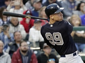 New York Yankees' Aaron Judge hits a triple to drive in two runs in fifth inning of a spring baseball exhibition game against the Atlanta Braves, Monday, March 18, 2019, in Kissimmee, Fla.