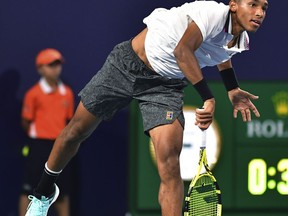 Felix Auger-Aliassime, of Canada, serves to Borna Coric, of Croatia, during the quarterfinals of the Miami Open tennis tournament Wednesday, March 27, 2019, in Miami Gardens, Fla.