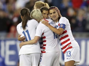 United States' Tobin Heath, second from right, is congratulated on her goal by Mallory Pugh (11), Megan Rapinoe and Alex Morgan (13) during the first half of a SheBelieves Cup soccer match against Brazil Tuesday, March 5, 2019, in Tampa, Fla.